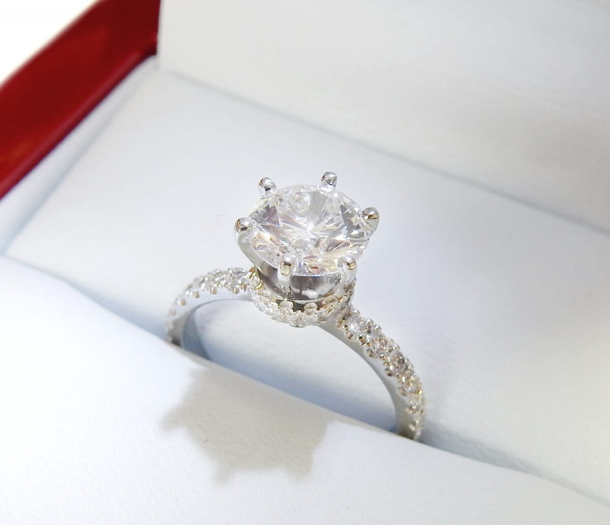 Six prong engagement ring with diamond collar