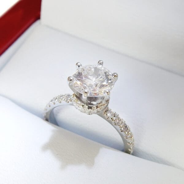 Six prong engagement ring with diamond collar