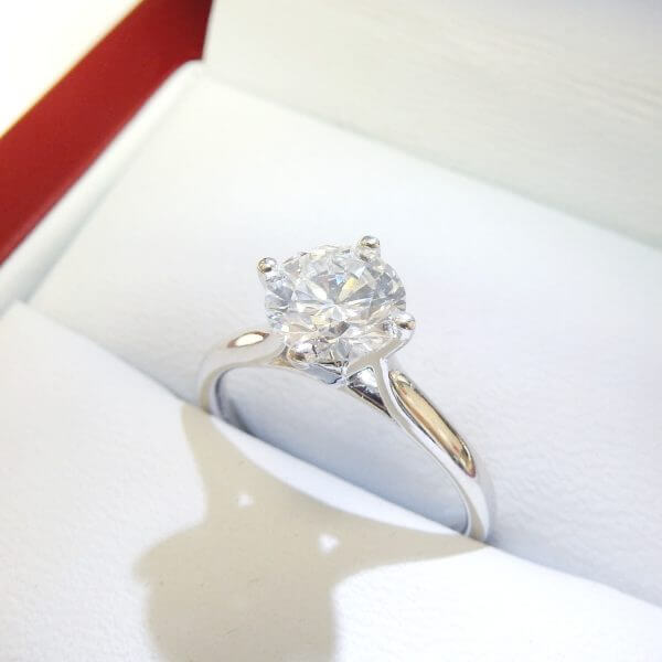 North south diamond engagement ring