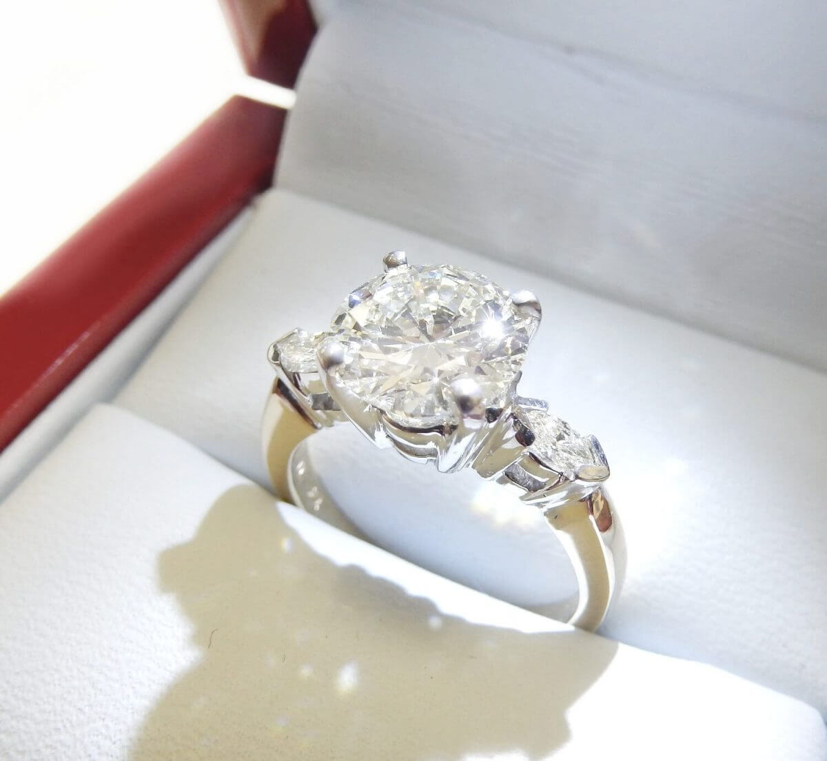 Three stone diamond engagement ring marquise brilliant round