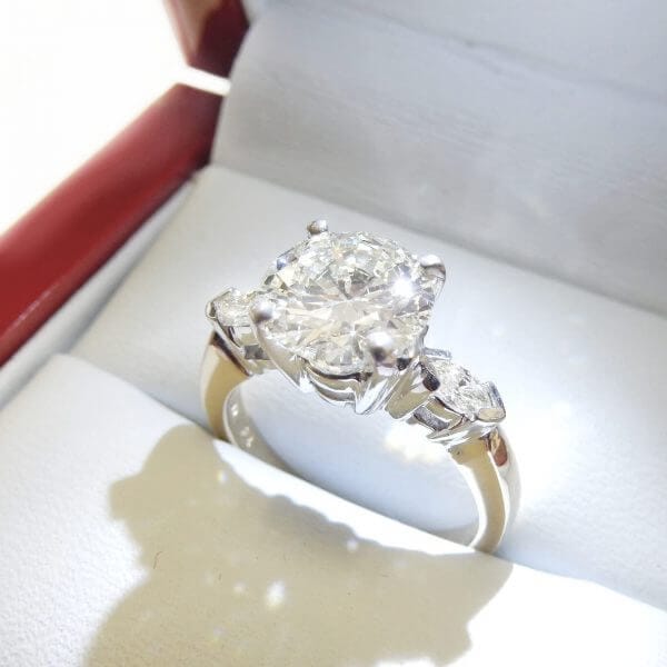 Three stone diamond engagement ring marquise brilliant round