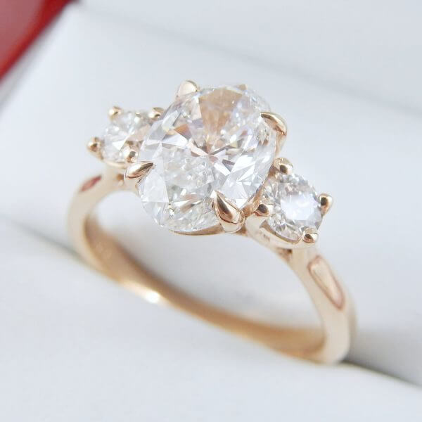 Oval-Diamond-Three-Stone-Rose-Gold-Engagement-Ring-IGI-DiamondNet.ca