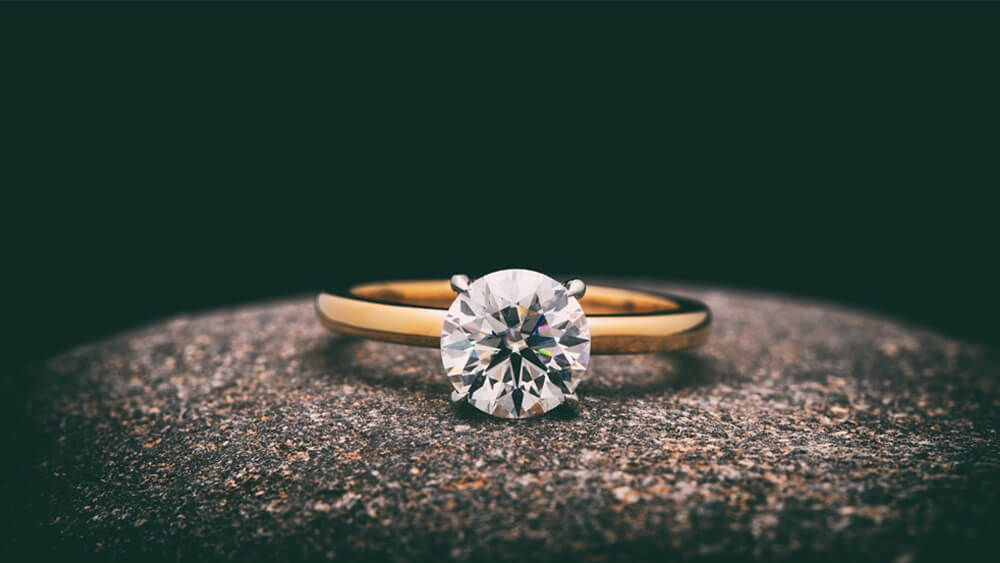 a beautiful classic engagement ring on rock