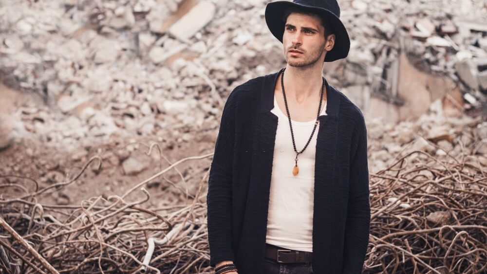 Handsome bearded man with hat and necklace