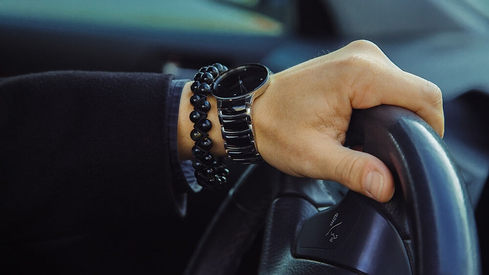 Male hand with watch and bracelet