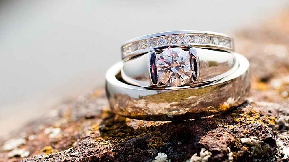 Wedding rings on rock with white gold