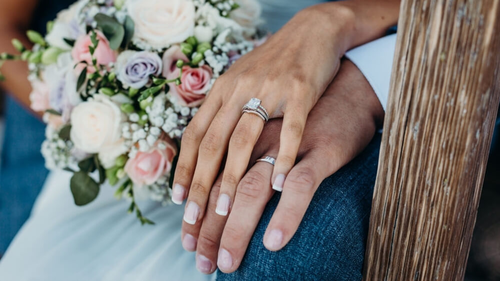 Couple rings worn by bride and groom