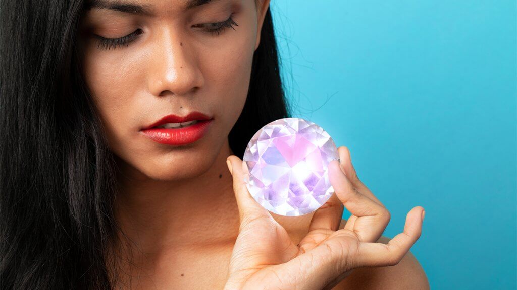Beautiful crystal gem in a woman hand