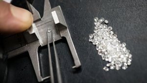 Jewellery craft laboratory selecting melee diamonds