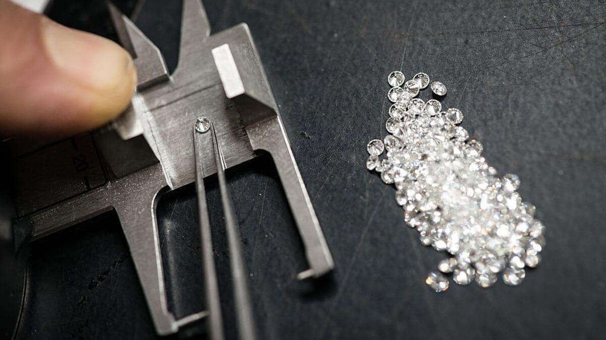 Jewellery craft laboratory selecting melee diamonds