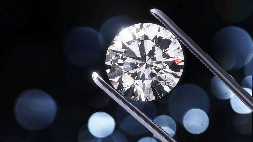 Luxury diamond in tweezers