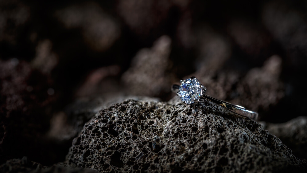 Ring decorated with diamond placed on a stone