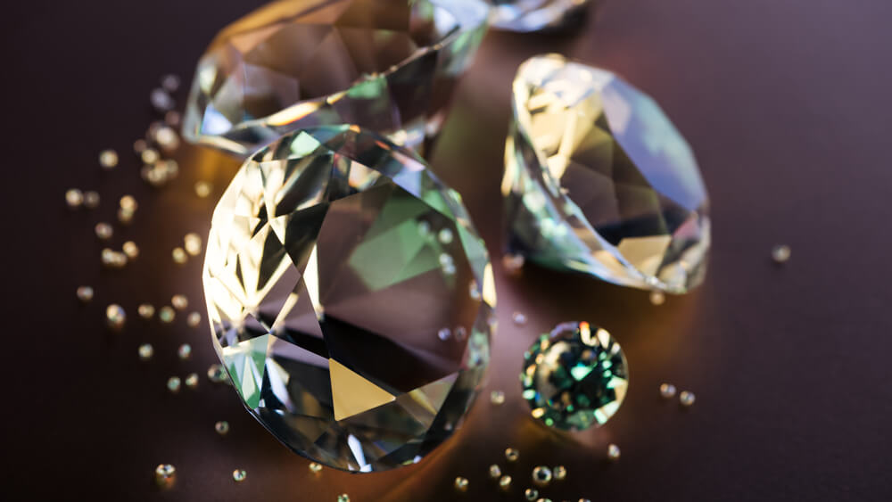 Selective focus of clear diamonds on brown background