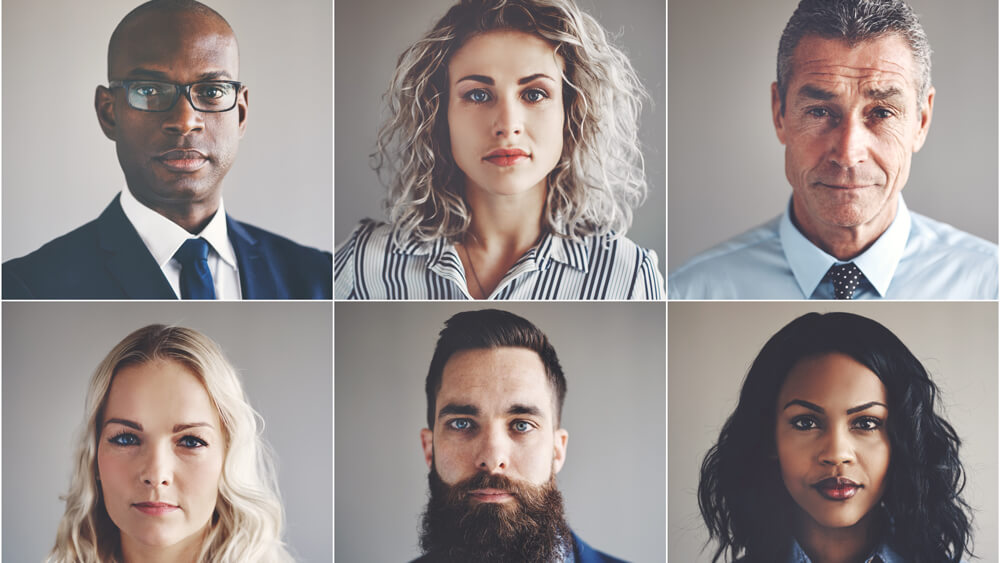 Ethnically diverse group of focused businessmen