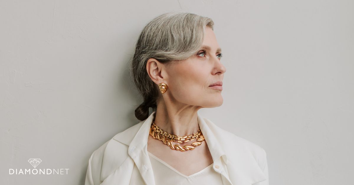A woman displays bold jewellery, representing the bold jewellery styles for 2025