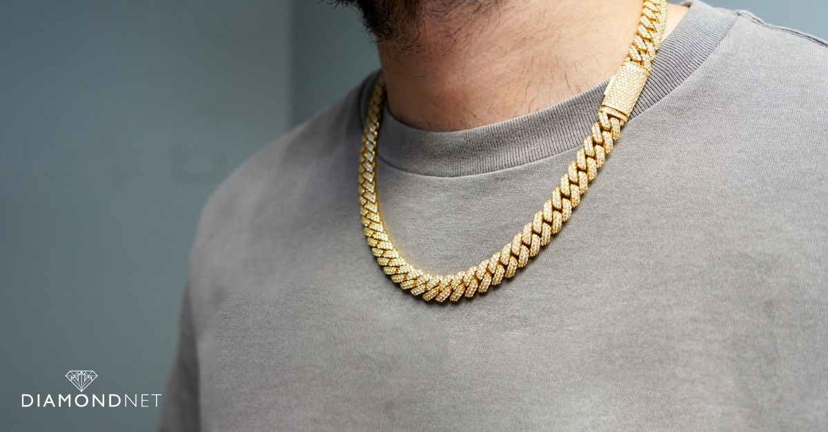 A well-dressed man with a gold chain, exemplifying men's jewellery trends.