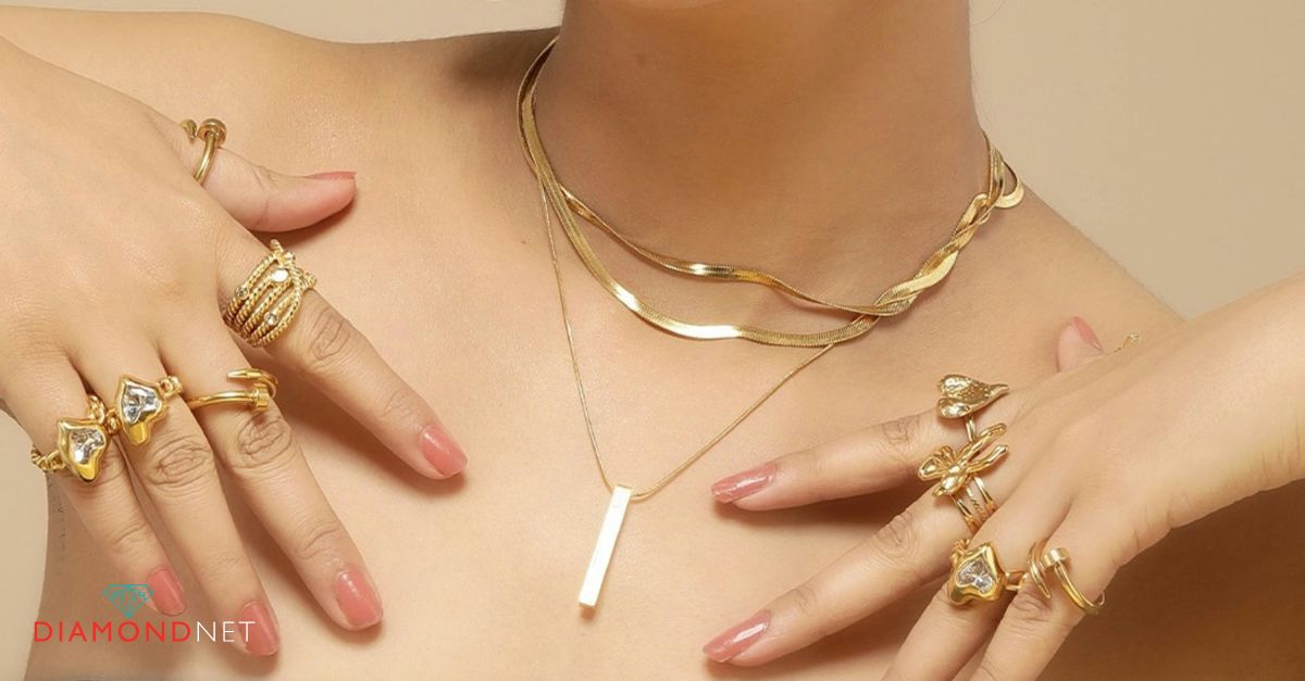  A gold necklace, earrings, and ring displayed on a surface, showcasing budget-friendly Valentine's Day jewellery