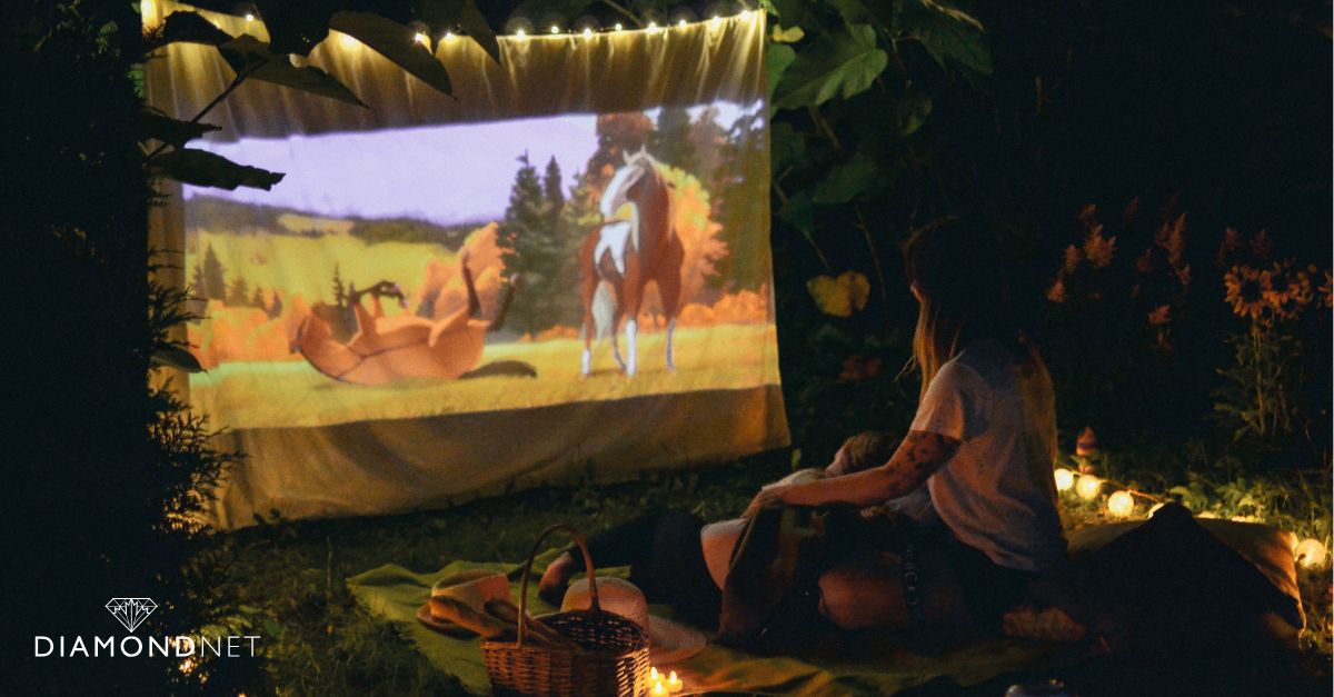 A cozy backyard setup featuring a couch and a TV, perfect for holiday movie night proposals