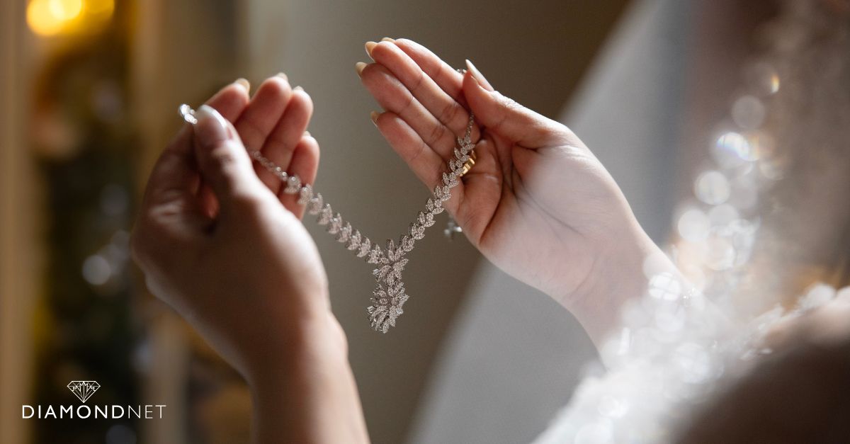 A woman in a wedding dress adorned with a stylish necklace and bracelet, showcasing Vancouver bridal jewelry trends