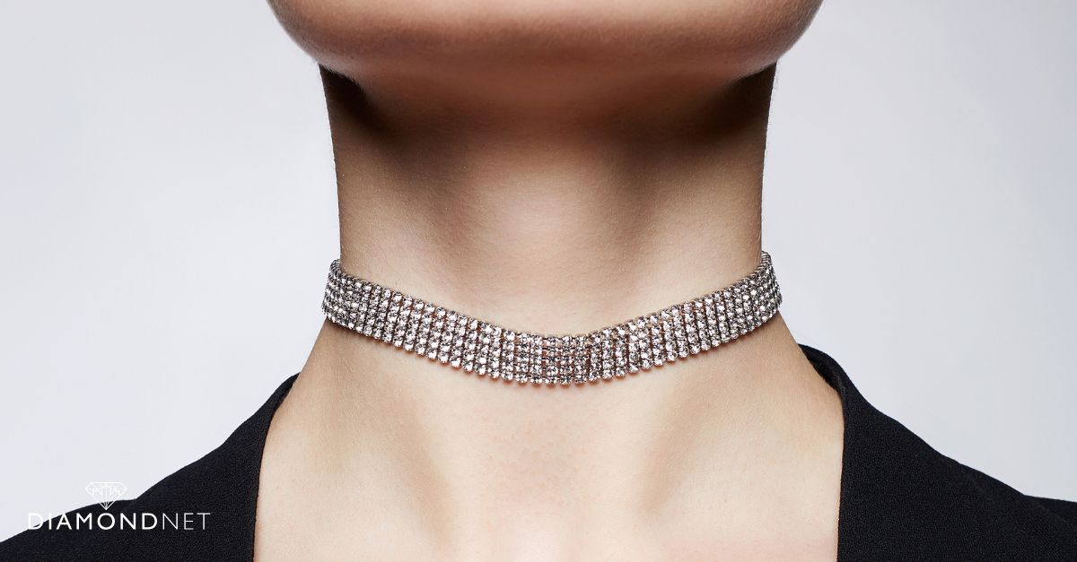 A diamond choker necklace worn with an off-shoulder gown
