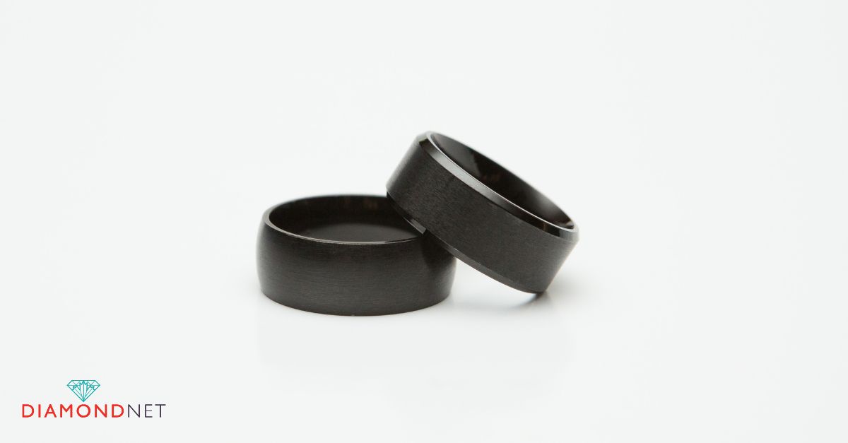 Man showing his black wedding ring close-up