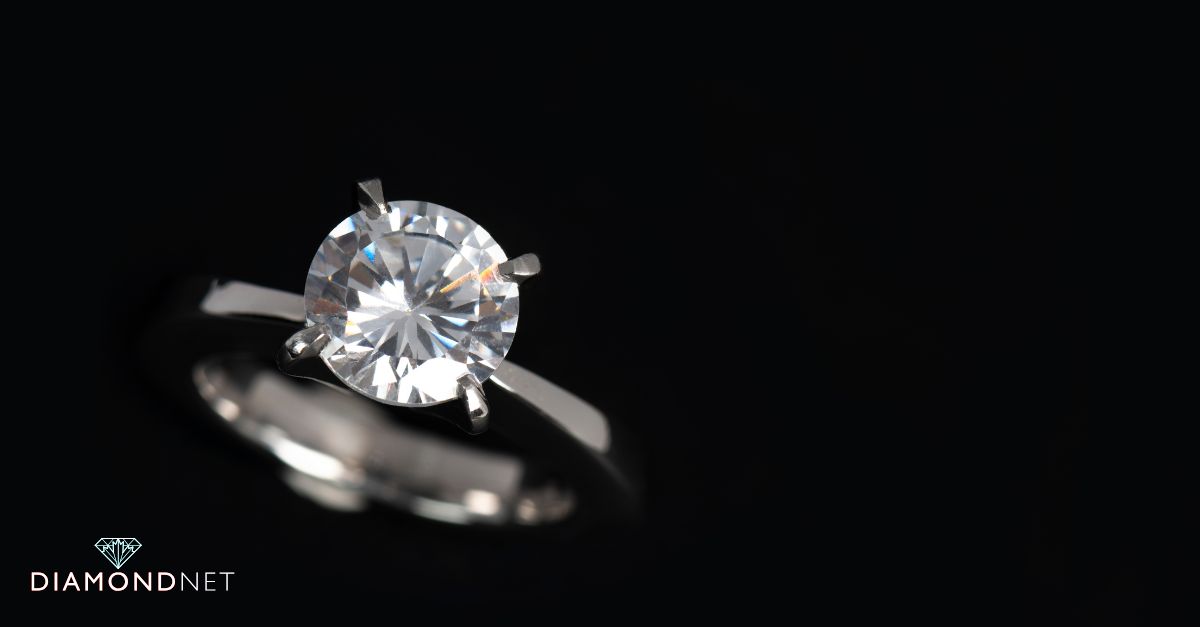Engagement ring with narrowing band near the gem
