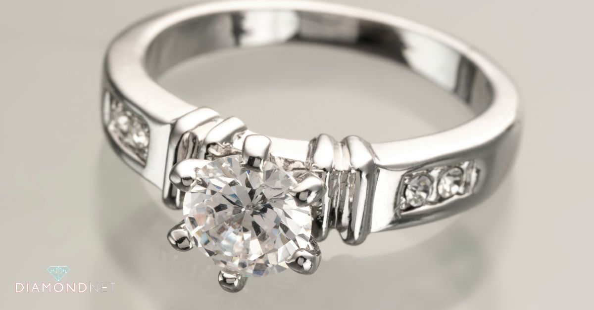 A jeweler explains a ring design to a customer